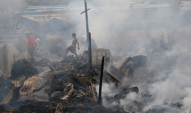 Building collapse in Philippines kills one, 20 trapped