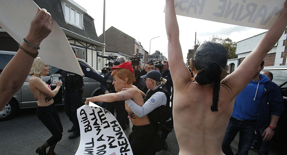 Femen place banner in anti-Le Pen protest