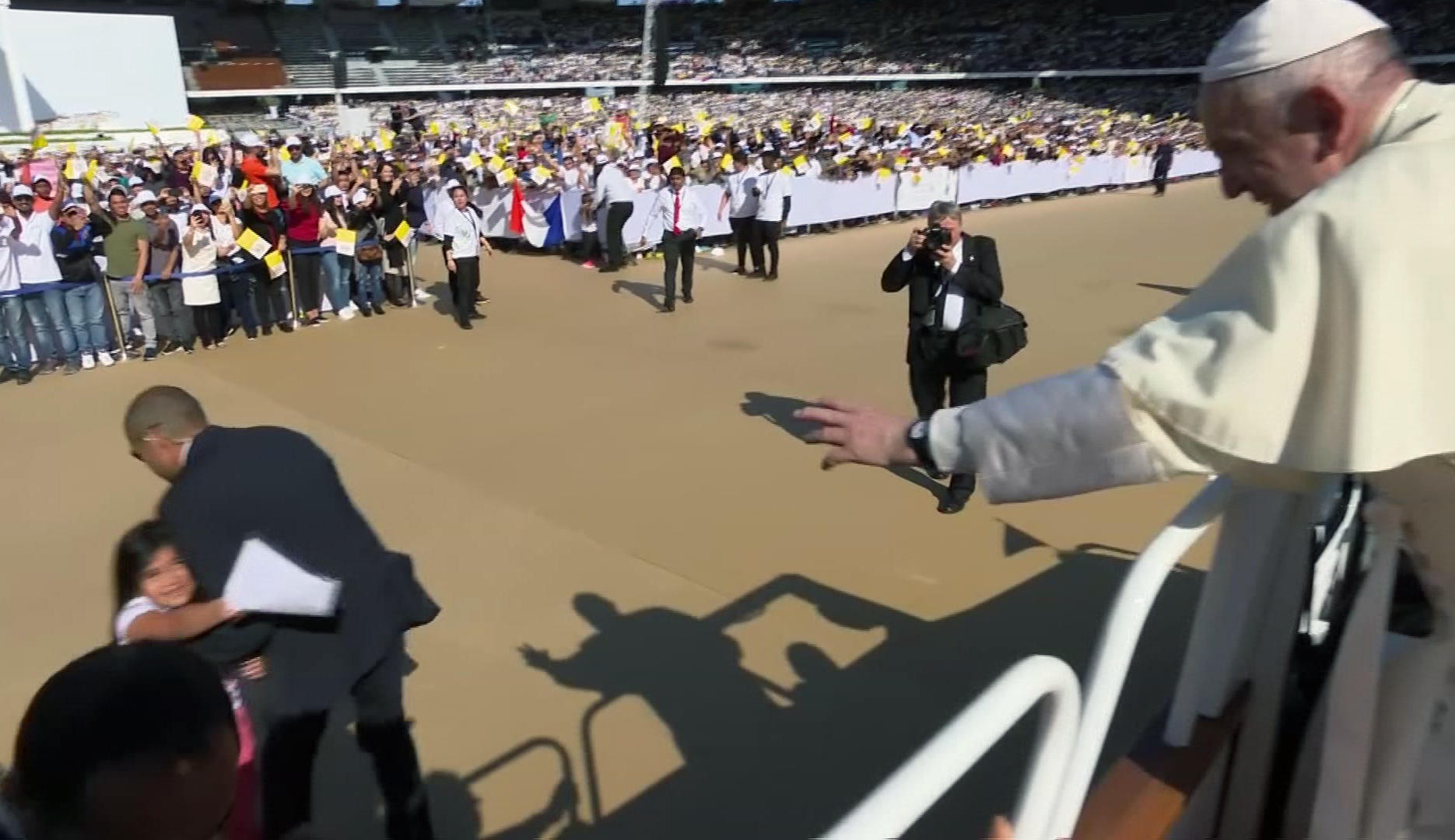 Little girl breaks through security to greet Pope Francis