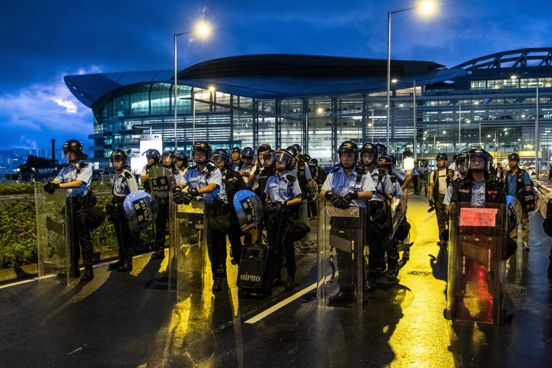 Hong Kong police fire gun and use water cannon on protesters