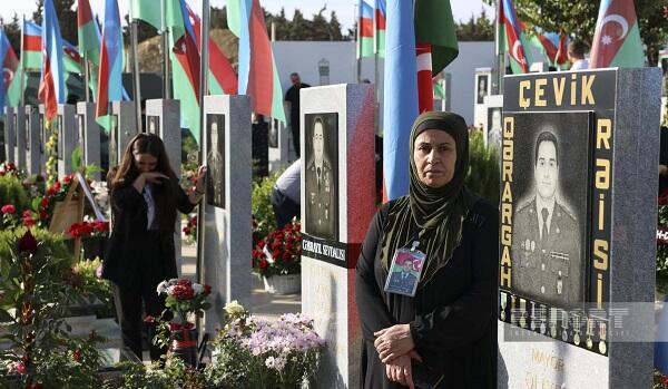 People commemorate martyrs at the Second Alley of Honor -