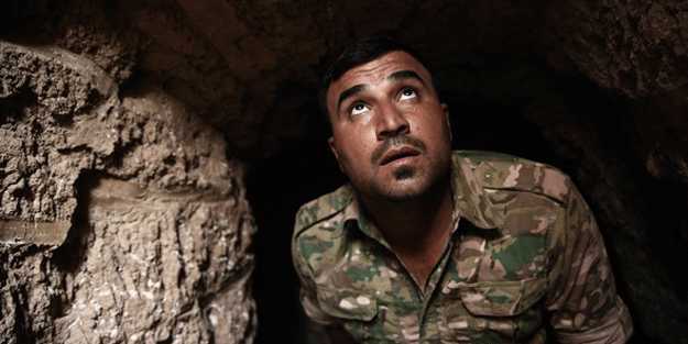 Mosulun girişinə 20 insan başı asdılar - Qorxunc iddia