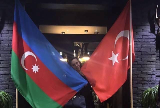 Asena wrapped Azerbaijani flag